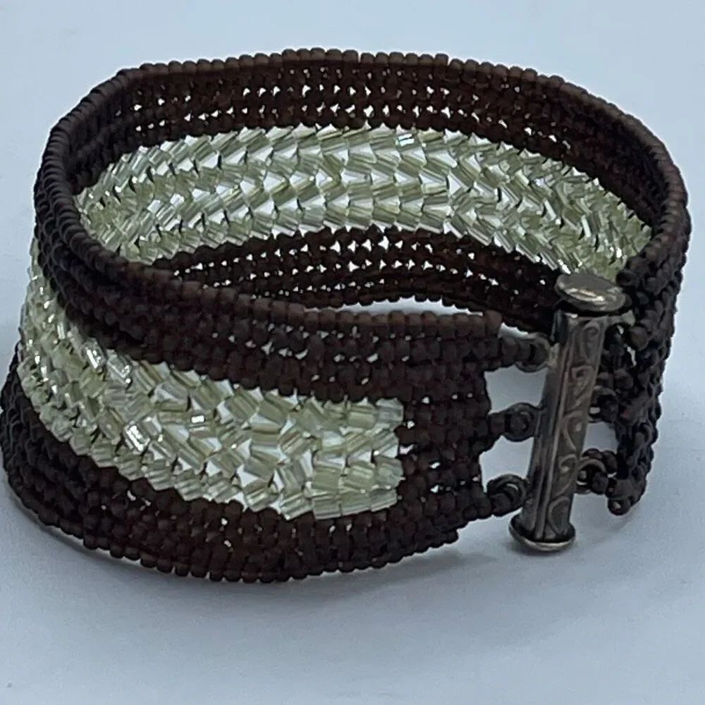 Vintage glass beaded bracelet w/ornate Sterling trombone clasp.